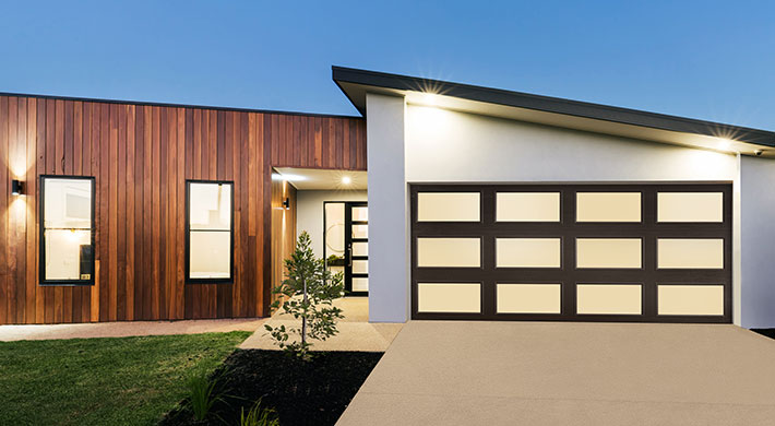 Modern home showcasing Amarr's Classica Full View garage doors
